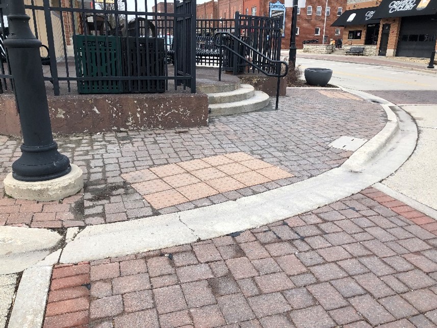 Image of a raised brick crosswalk