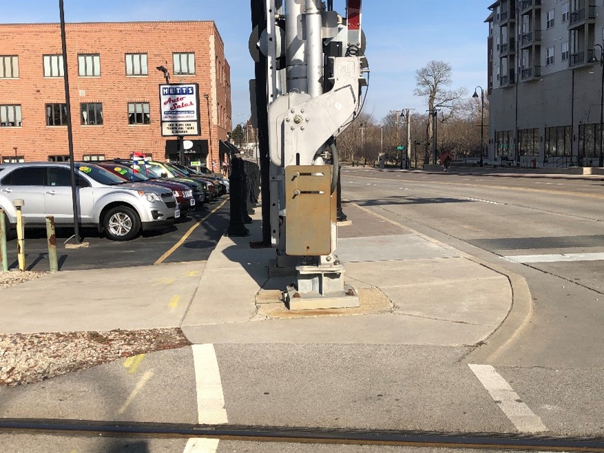 Image of railroad crossing arm blocking sidewalk