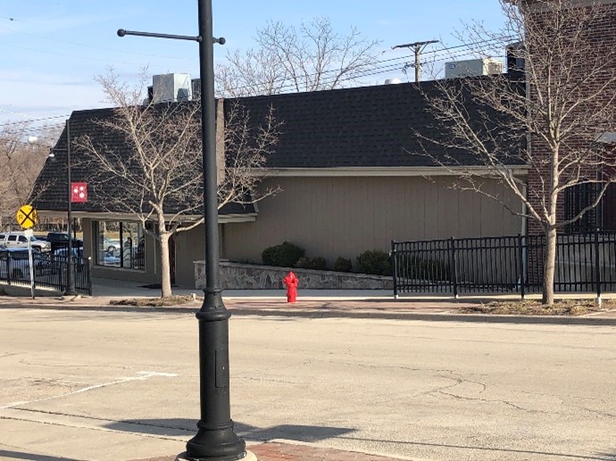 Image of a downtown sidewalk with steep grading